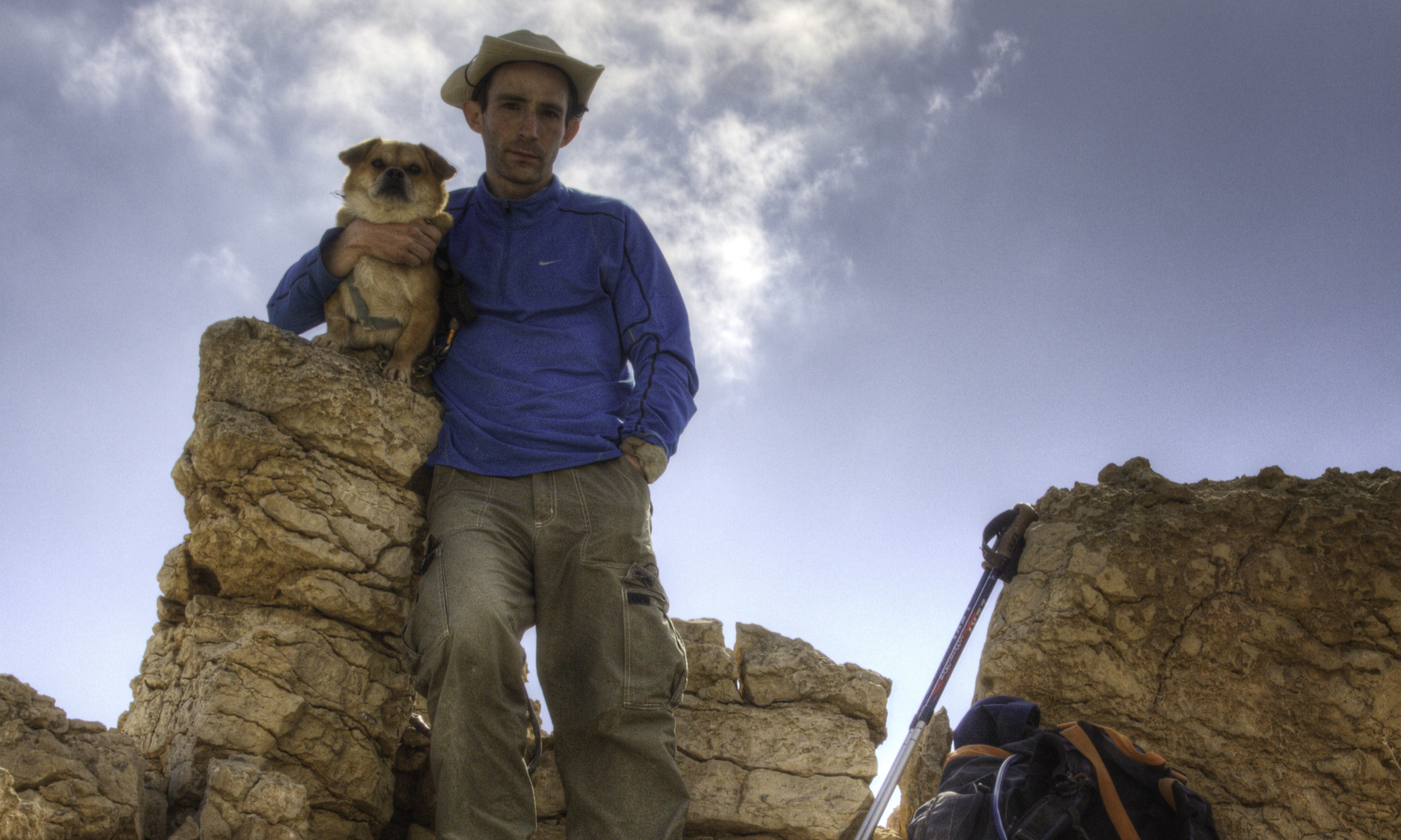 Assaf and his trusty companion Booli posing together atop a rocky crest